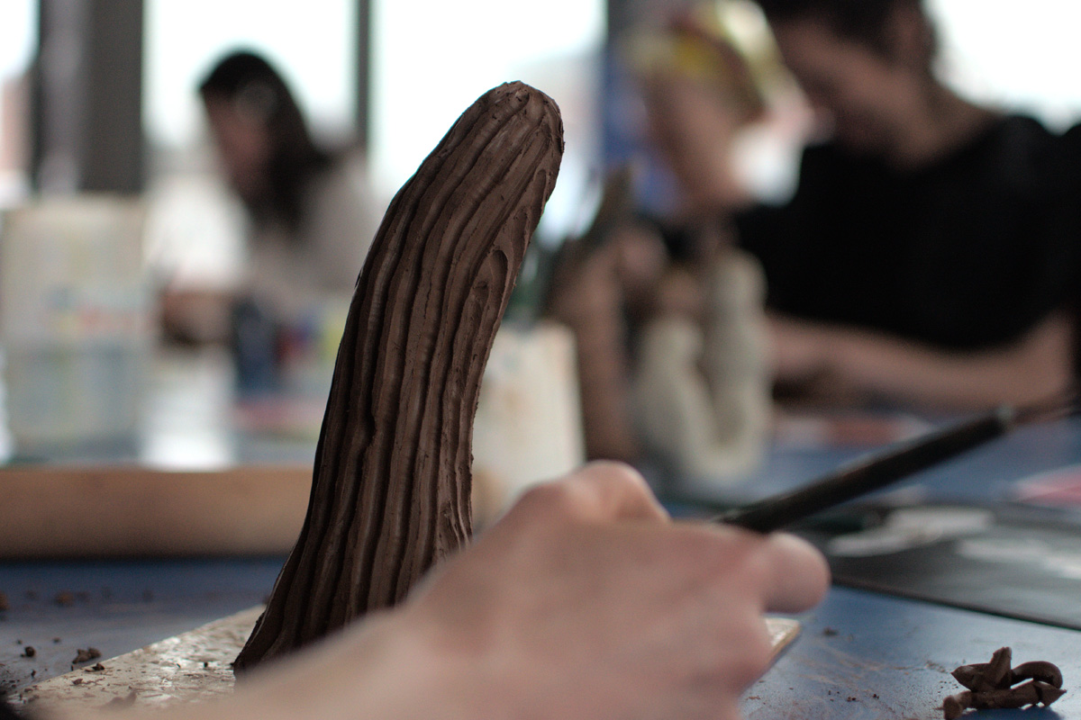 hands working with clay