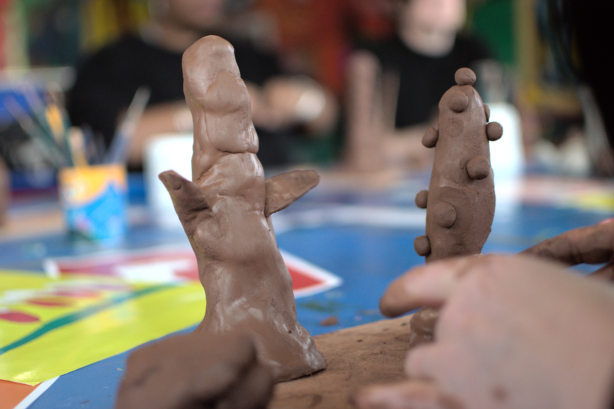 hands working with clay