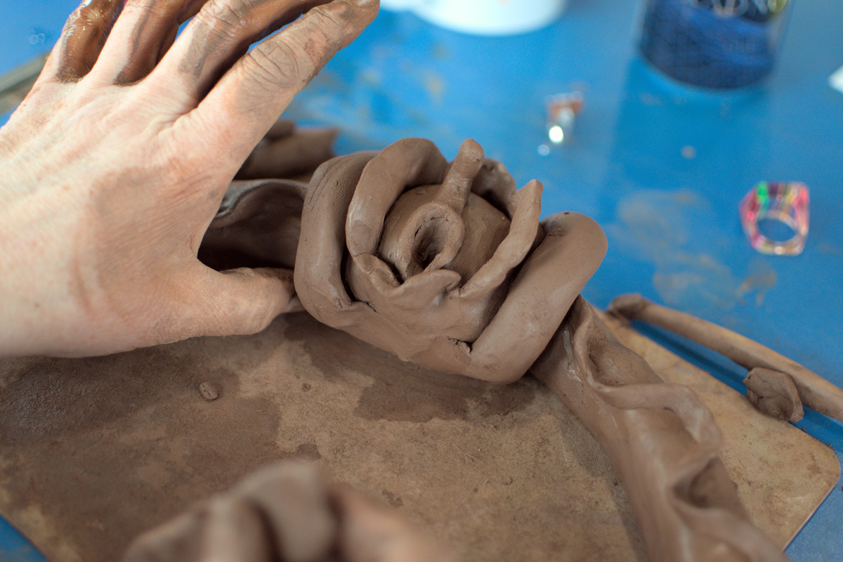 hands working with clay