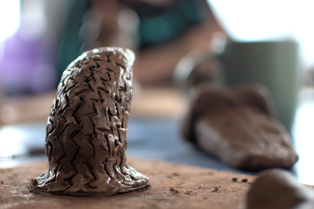 hands working with clay