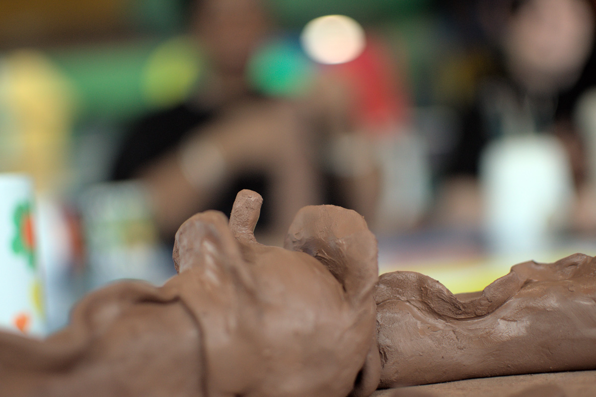 hands working with clay
