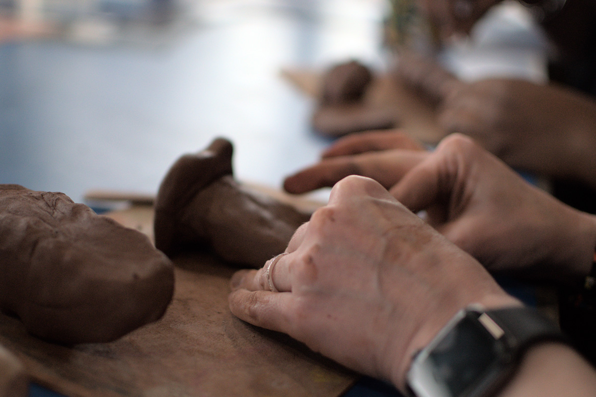 hands working with clay