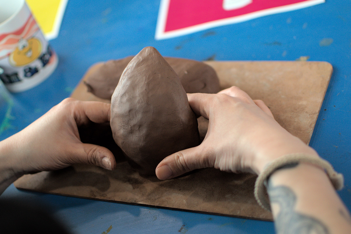 hands working with clay