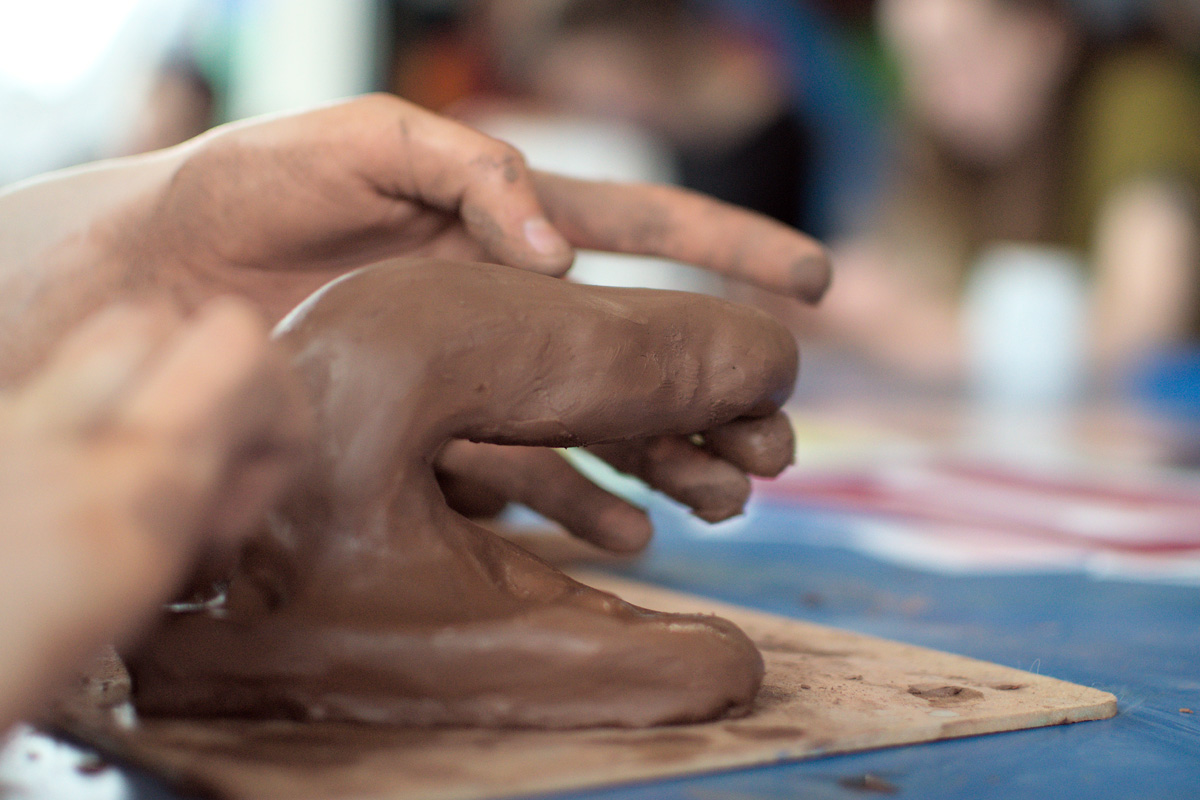 hands working with clay