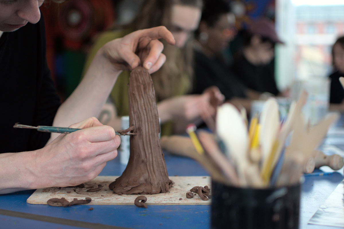 hands working with clay