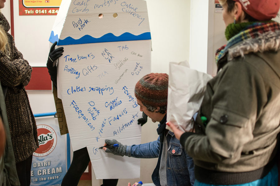 participant writing on ailie dressed as iceberg
