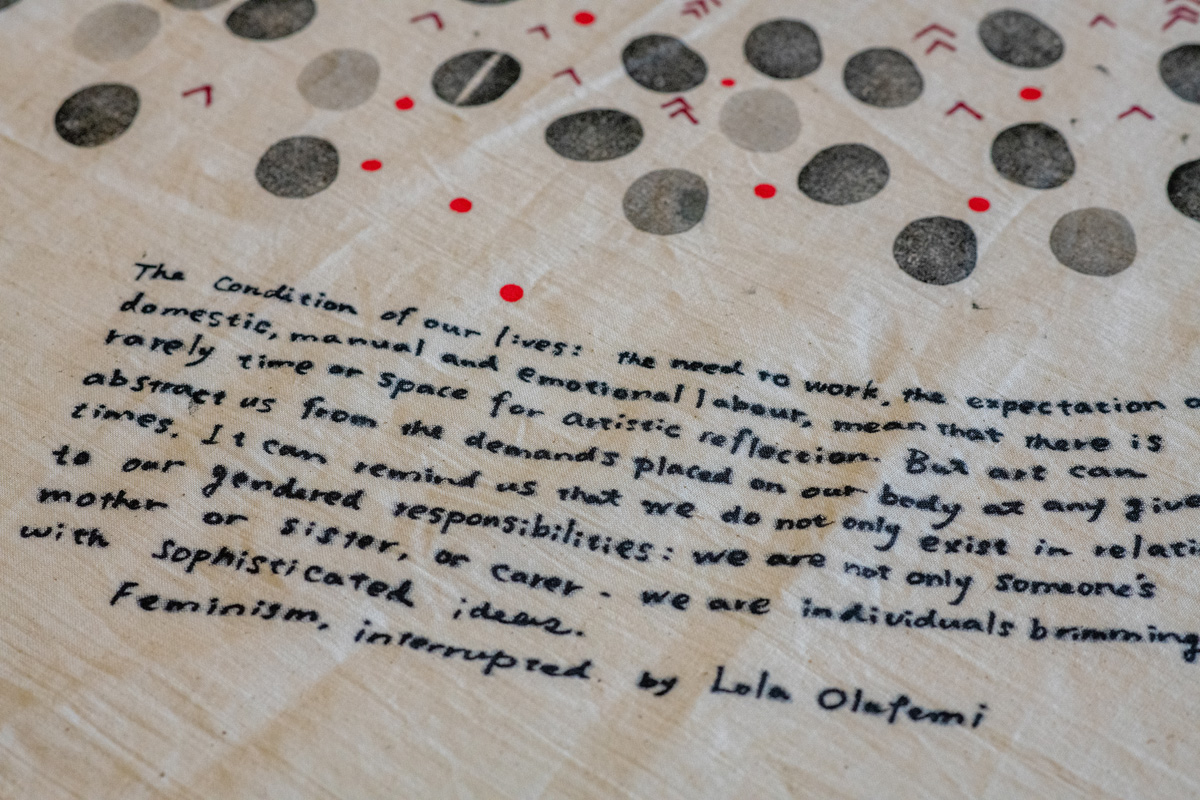 hand using block prints to create a map using symbols