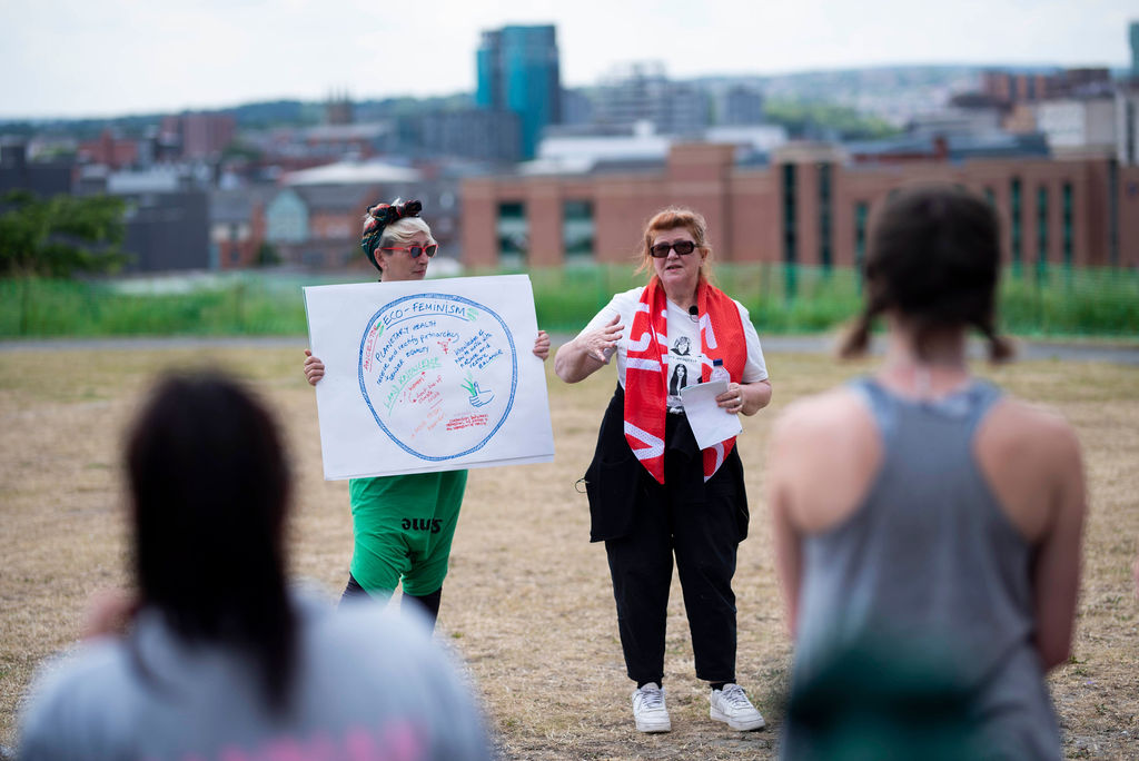 coaches showing team diagram for ecofeminism